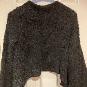 Black little girls sweater. Long sleeve and cape like